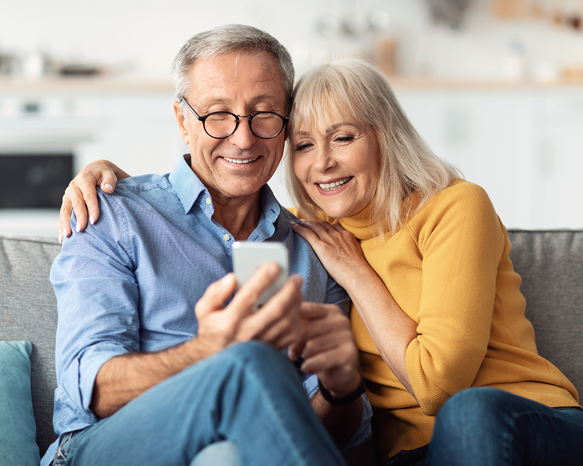 Happy Couple Looking at their Phone