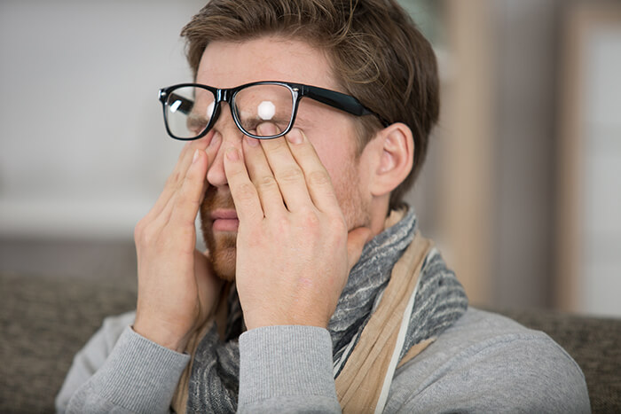 Man rubbing his eyes