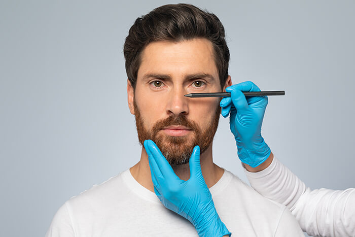 Man being prepped for plastic surgery